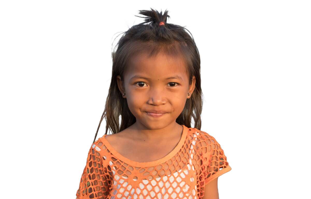 Una niña sonriendo. Foto de Basile Morin.